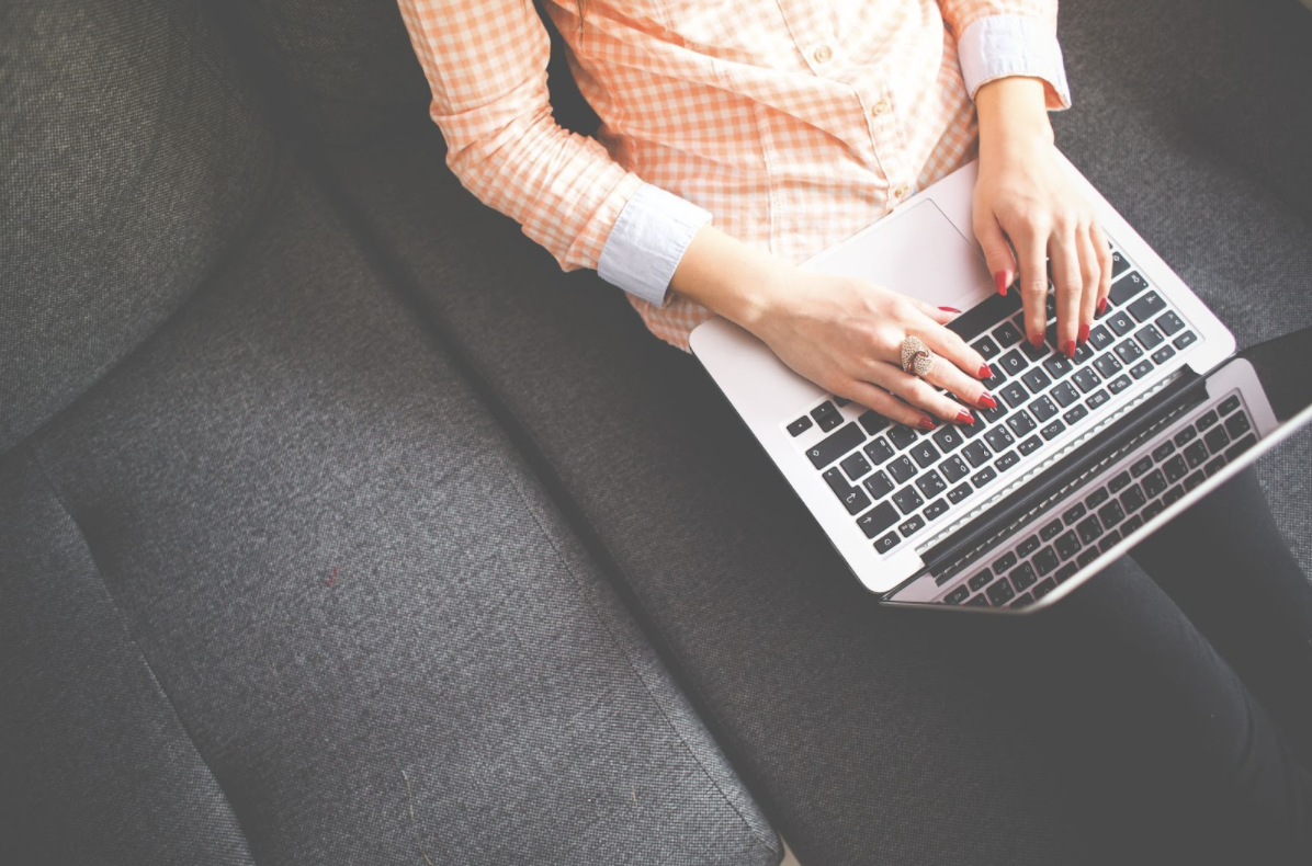 woman typing on a laptop